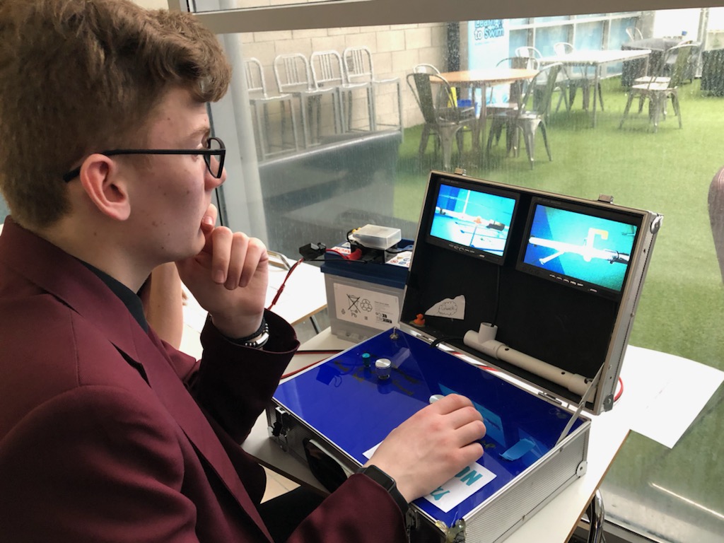 boy looking at ROV control screen