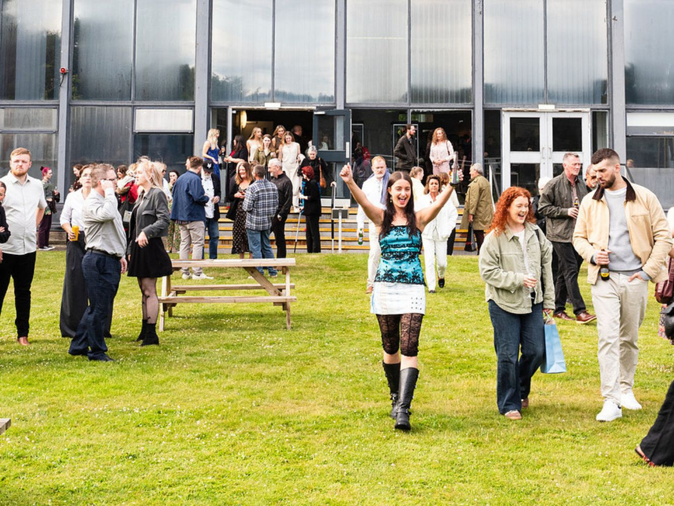 people outside gray's school of art on the grass