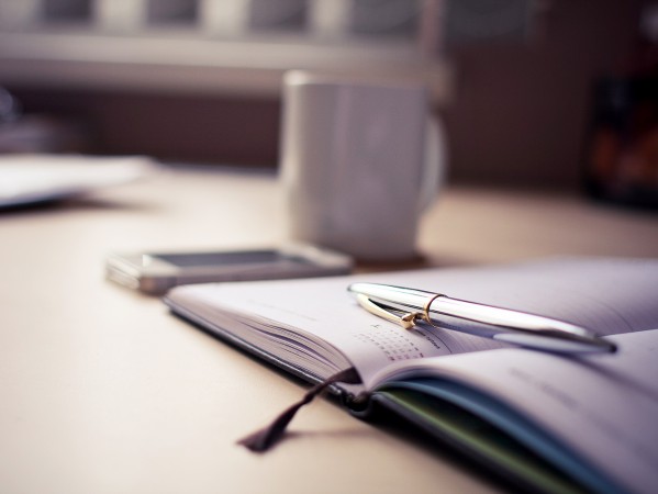 pen sitting on a notebook