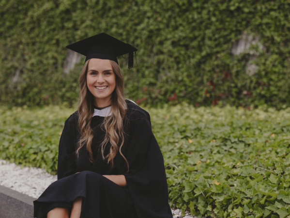 Aimee Work posing at graduation Aimee Work posing at graduation