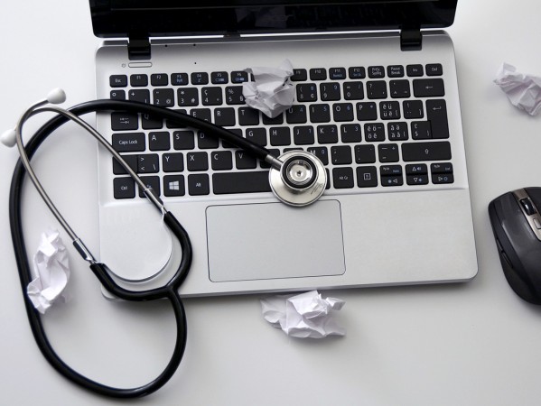 a laptop with a stethoscope a laptop with a stethoscope
