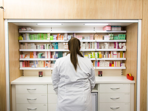 Someone standing at a pharmacy shelf at RGU Someone standing at a pharmacy shelf at RGU
